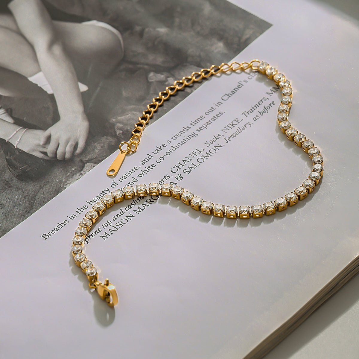 Gold and pearl bracelet on an open book