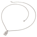 Silver necklace with a rectangular pendant on a white background