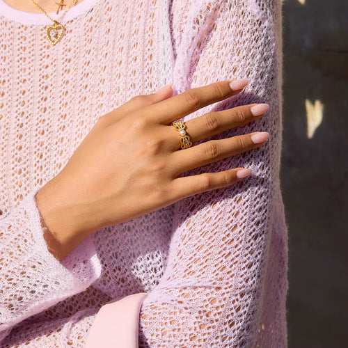Waterproof Ballerina’s Pearl gold ring with an intricate openwork lace design.