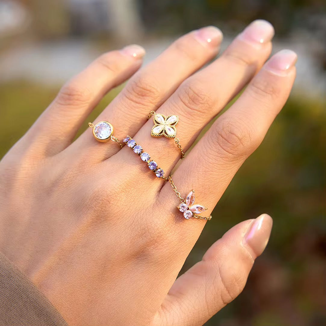 Detail of the pear-cut cubic zirconia crystals on the Lyra Clover charm.