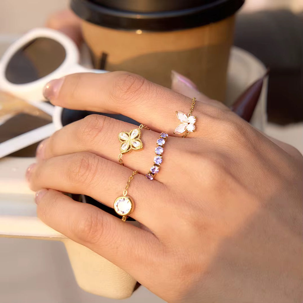 Lightweight 1.2g gold clover ring on white background with product ID JDR0312204.