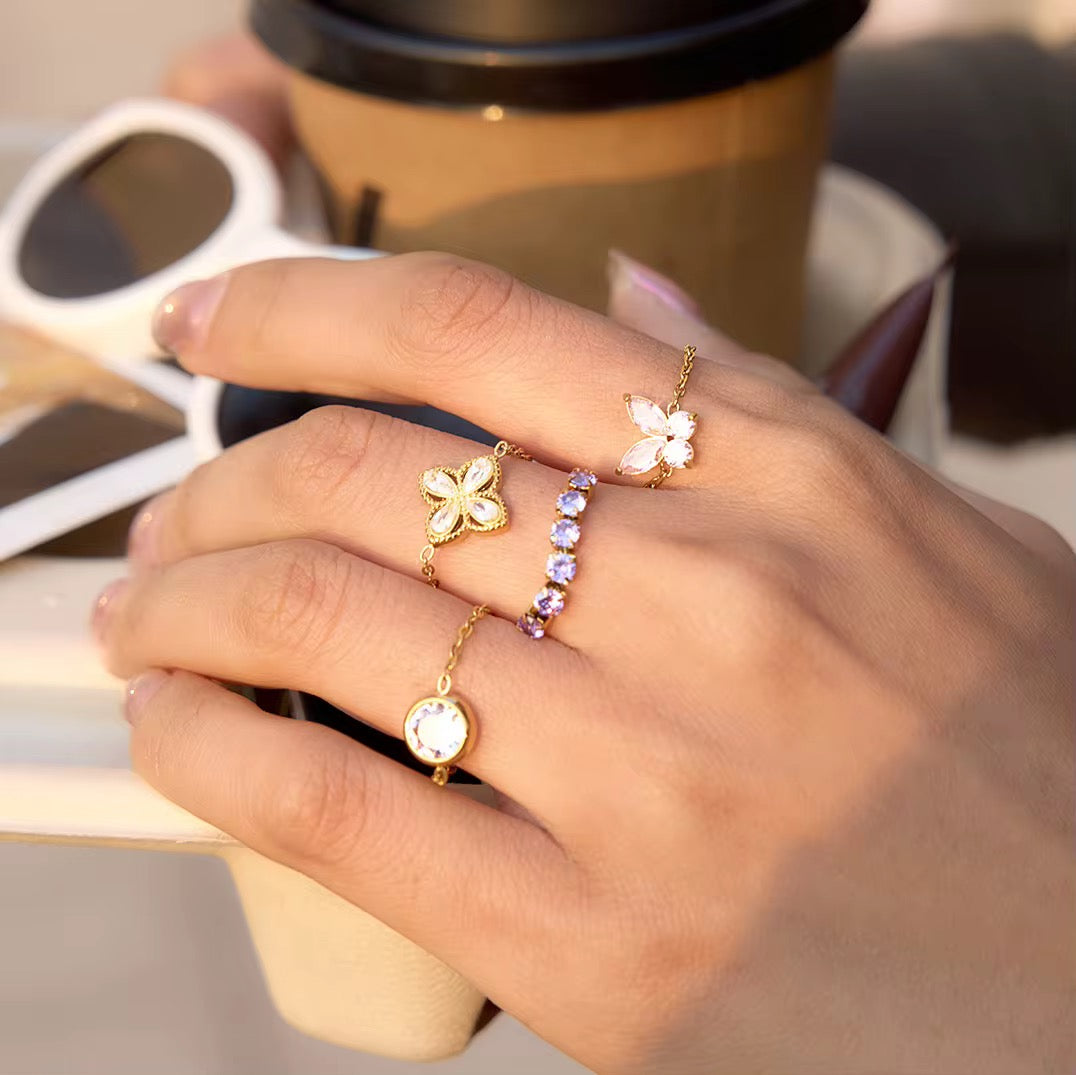 Lightweight 1.2g gold clover ring on white background with product ID JDR0312204.