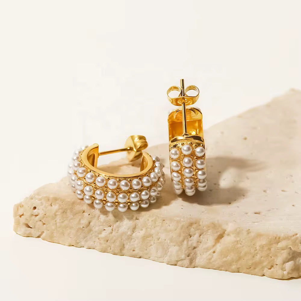Mother of All Hoops featuring triple rows of pearls and 18k gold PVD plating.