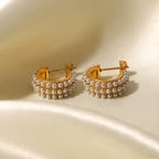 Waterproof gold pearl hoop earrings for swimming and active lifestyles.