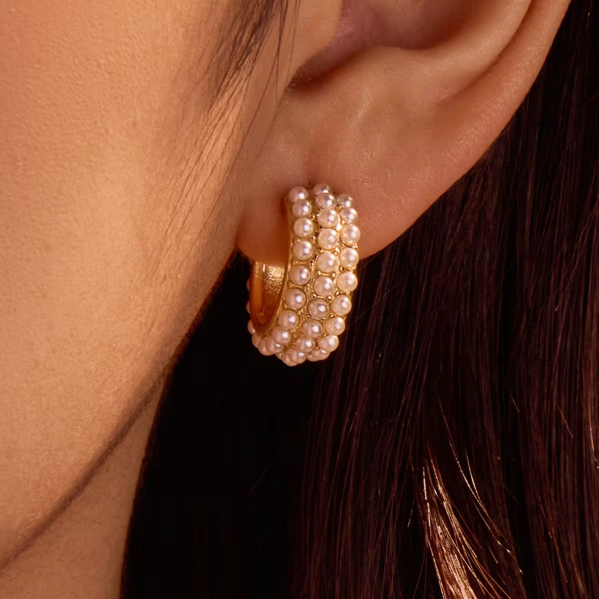 Hypoallergenic 18k gold plated stainless steel pearl hoops for sensitive ears.