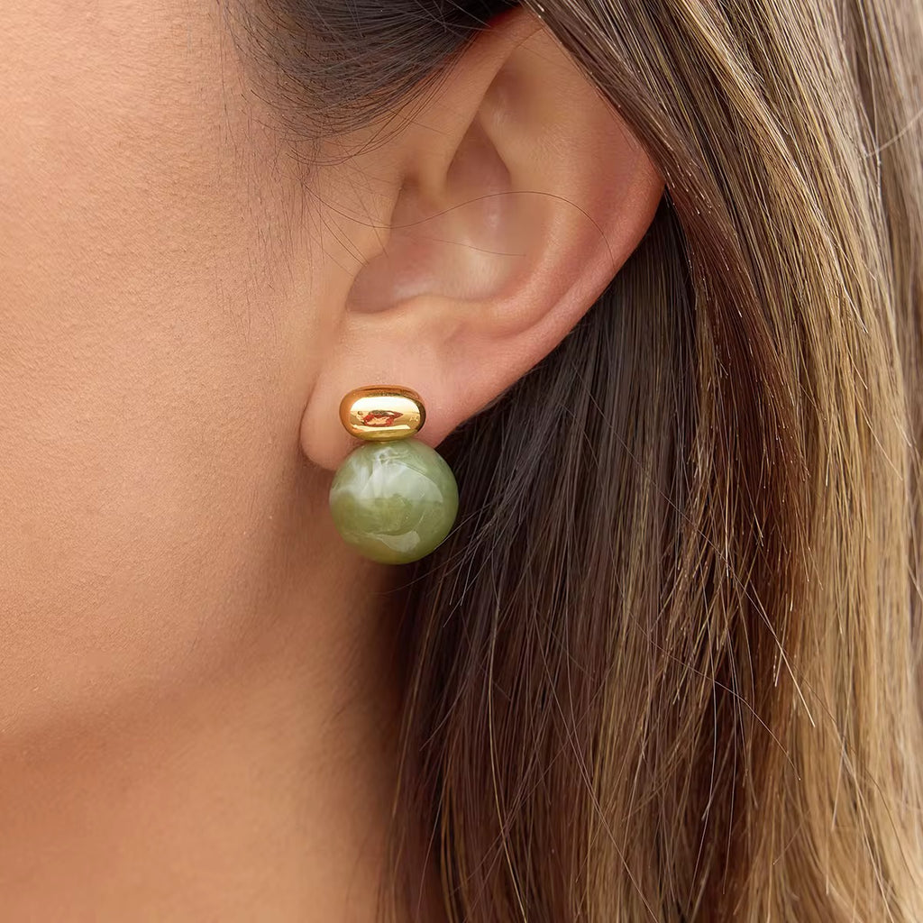 Sweat-proof gold and green jewelry for active lifestyles and beach vacation wear.