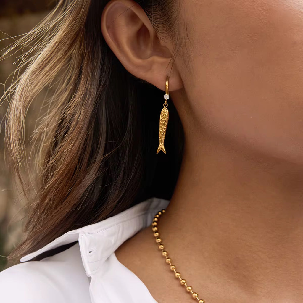 Hypoallergenic 18k gold plated stainless steel fish earrings for sensitive ears.