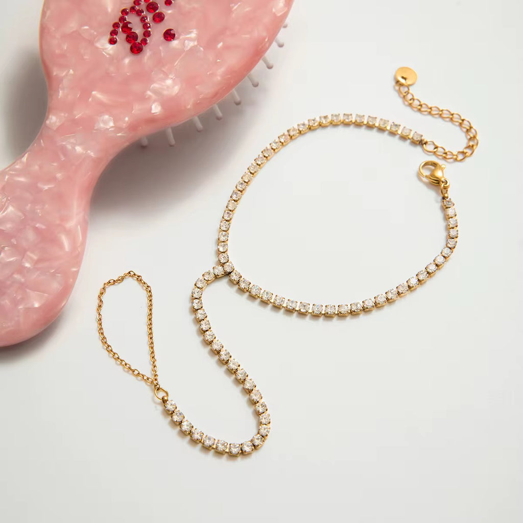 Tarnish-free ocean-proof The Tiara gold hand chain safe for salt water and swimming.