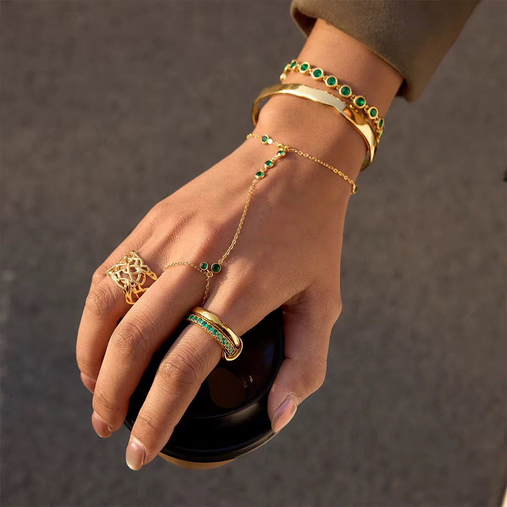 Hypoallergenic stainless steel Emerald Trace hand jewelry for sensitive skin.