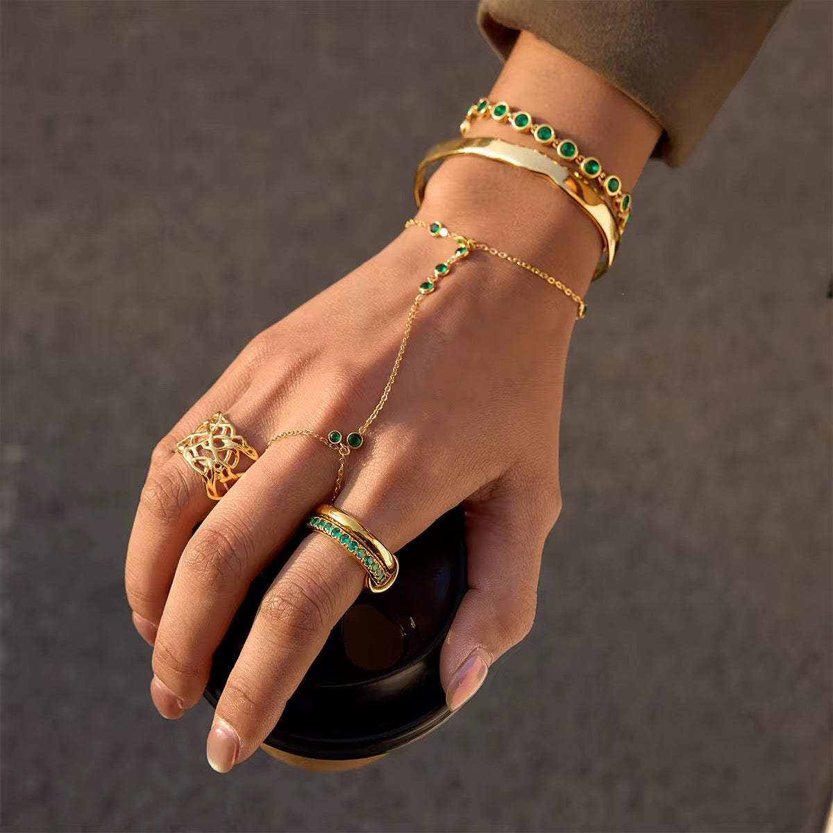 Hypoallergenic stainless steel Emerald Trace hand jewelry for sensitive skin.