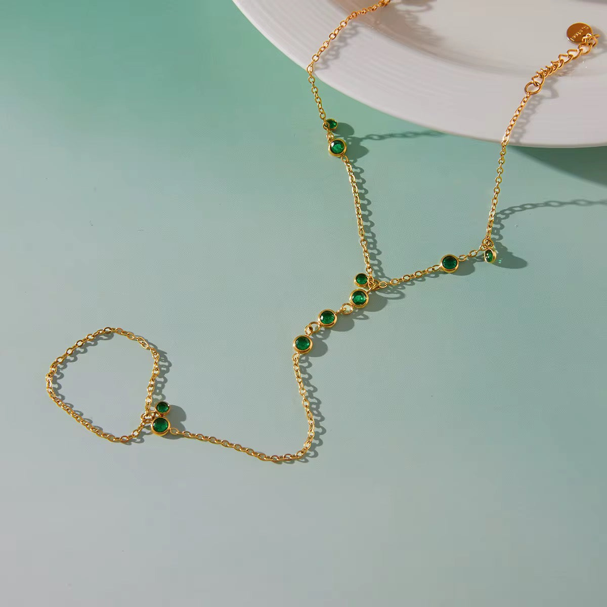 Tarnish-free ocean-proof Emerald Trace gold hand chain safe for salt water.
