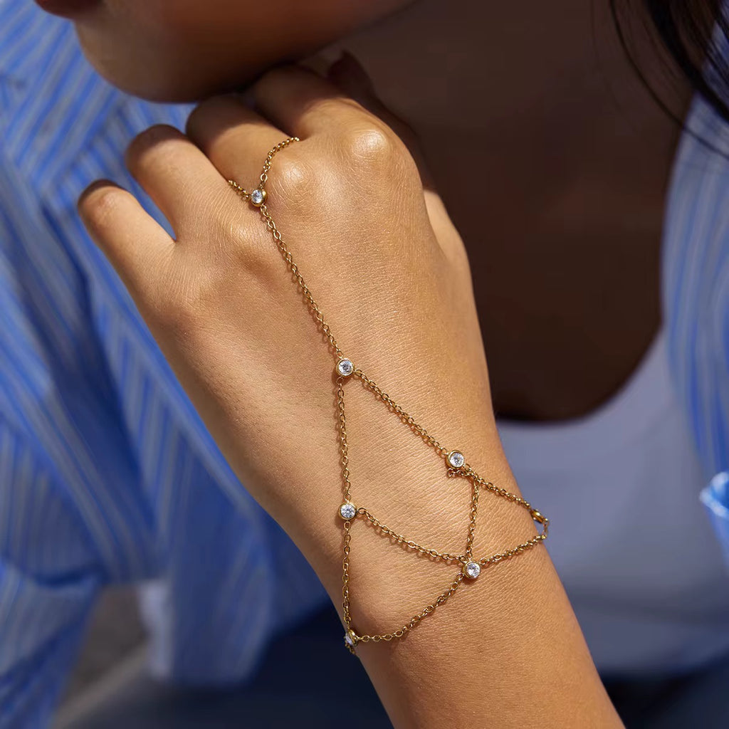 Velvet & Stone hand chain featuring 18k gold PVD plated stainless steel and crystals.