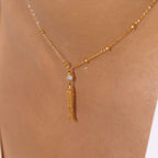 Waterproof Very Fishy Indeed gold necklace featuring a crystal-accented fish charm.
