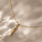 Tarnish-free Very Fishy Indeed gold pendant necklace safe for showering and swimming.