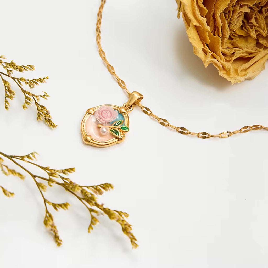 Rose Élan vintage floral pendant necklace in 18k gold PVD plated stainless steel.