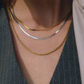 Third Harmony triple layered necklace with 18k gold rope and herringbone chains.