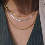 Third Harmony triple layered necklace with 18k gold rope and herringbone chains.