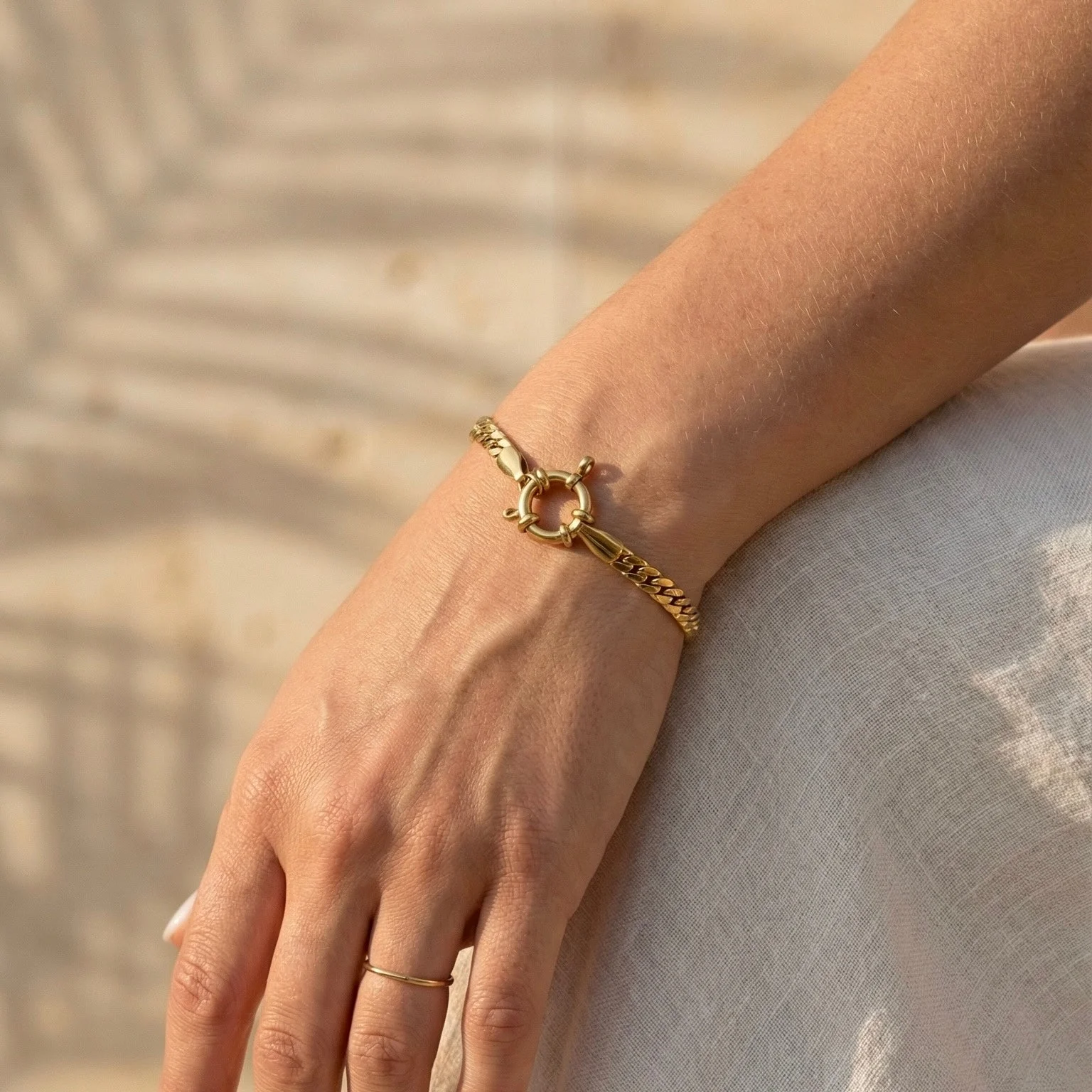 Waterproof The Foundry Coil gold bracelet featuring a 1.8cm nautical spring clasp.