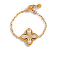 The Lyra Clover adjustable ring featuring 18k gold PVD plating and crystals.
