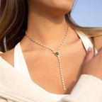 Windsor Emerald lariat necklace featuring 18k gold PVD plated stainless steel and a green stone.