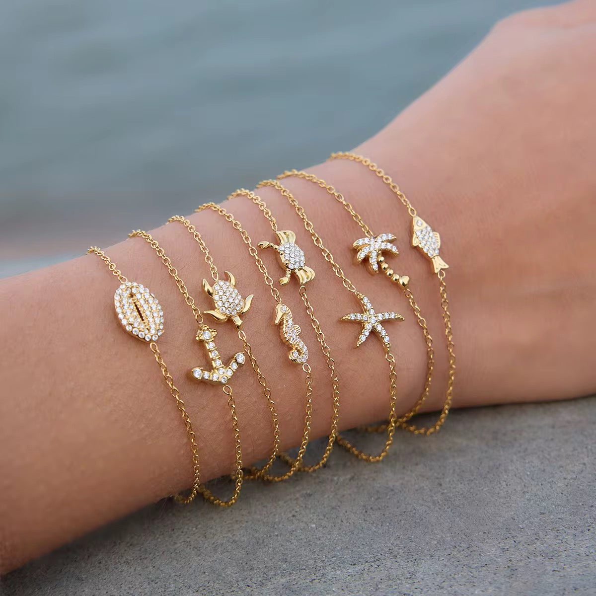 Waterproof gold sea creature bracelet for swimming and active coastal lifestyles.