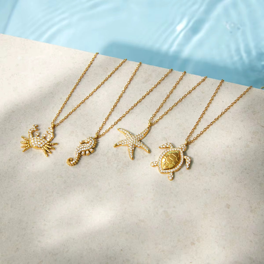 Ocean’s Treasures sea turtle pendant necklace in 18k gold PVD plated stainless steel.