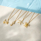 Ocean’s Treasures sea turtle pendant necklace in 18k gold PVD plated stainless steel.