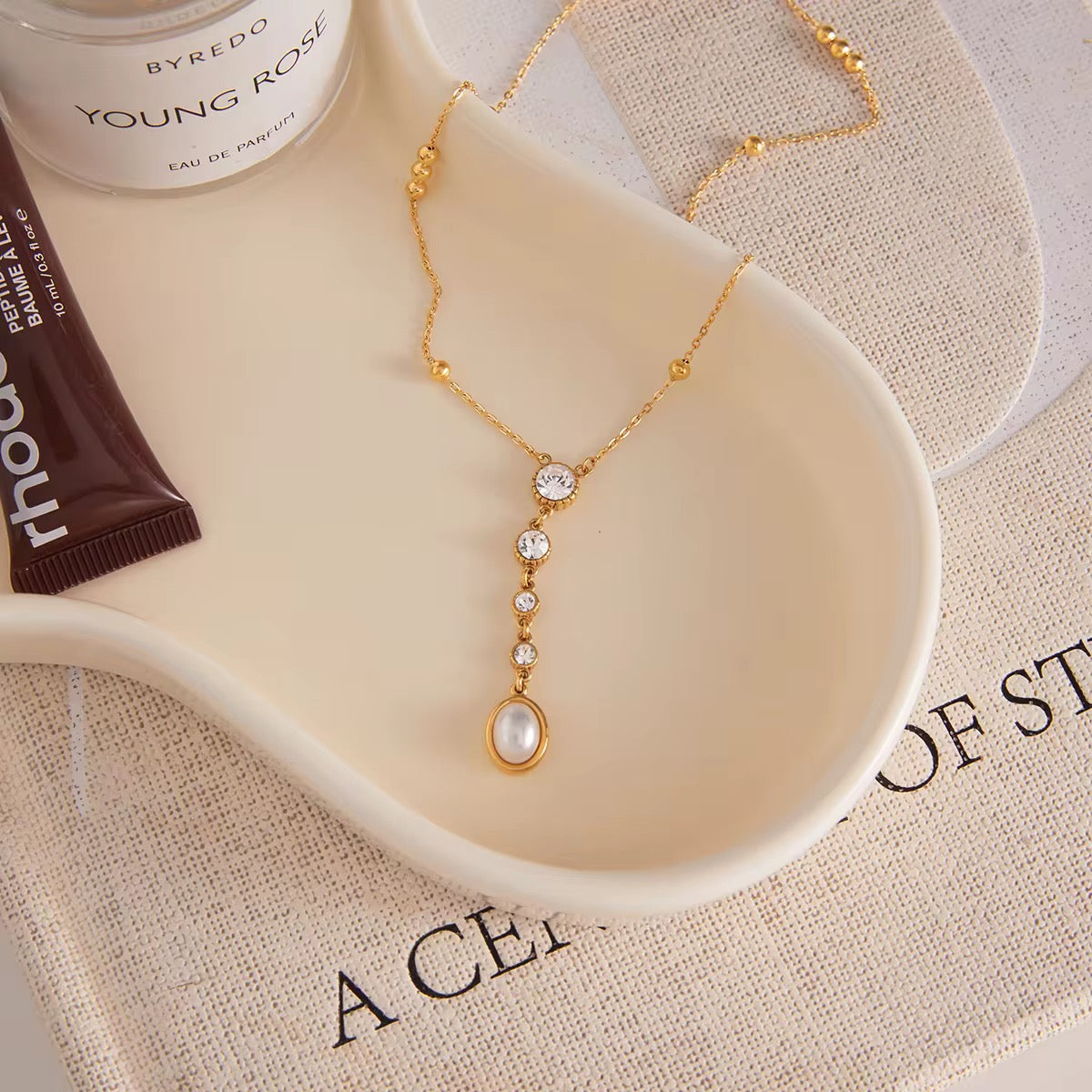Hypoallergenic 18k gold plated stainless steel station chain necklace for sensitive skin.