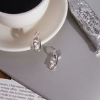Technical drawing of earrings showing a 2.41cm total length, 1.01cm hoop, and 0.25cm thickness.