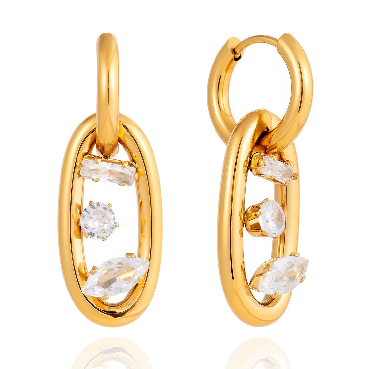 Detail of the baguette, round, and marquise-cut crystals floating within the gold oval link.