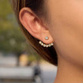 Celeste ear jackets featuring 18k gold PVD plated stainless steel and clear crystals.