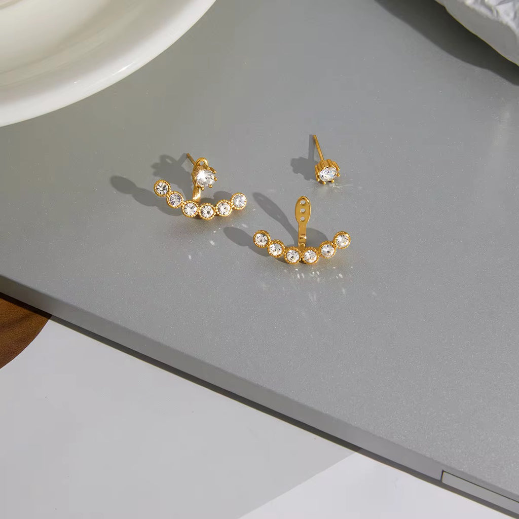 Waterproof gold ear jacket earrings with a seven-stone crystal arc for swimming.