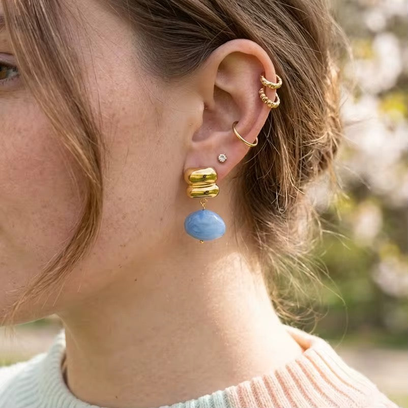 Waterproof gold earrings with natural white moonstone drops for swimming and daily wear.