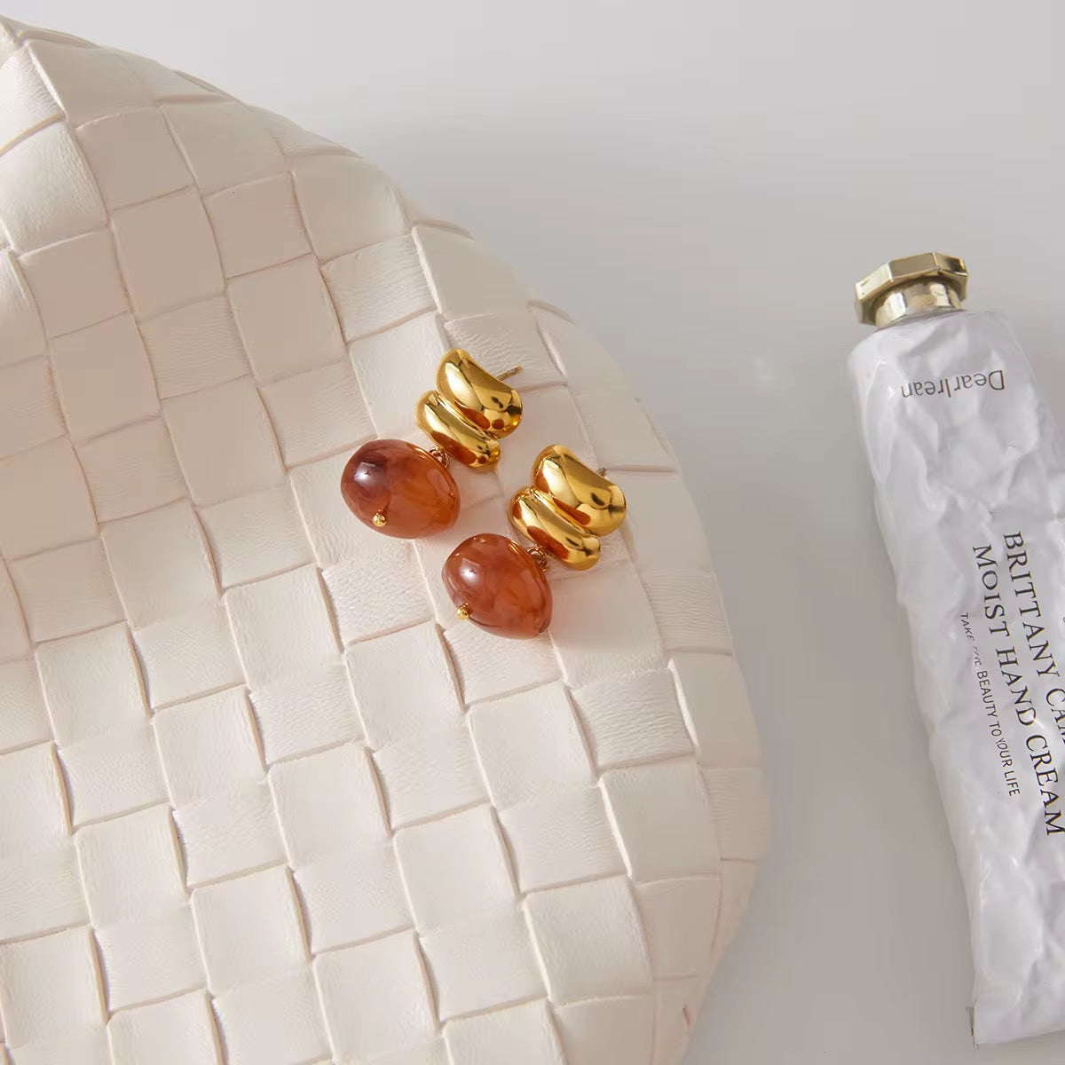 Non-tarnish 18k gold natural stone earrings with a 1-year anti-tarnish warranty.