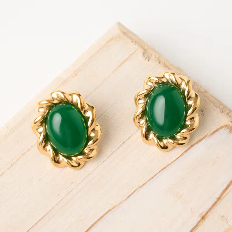 The Vintage Muse statement earrings featuring 18k gold PVD plating and green oval stones.
