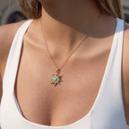 Waterproof gold celestial necklace with a turquoise center for swimming and daily wear.