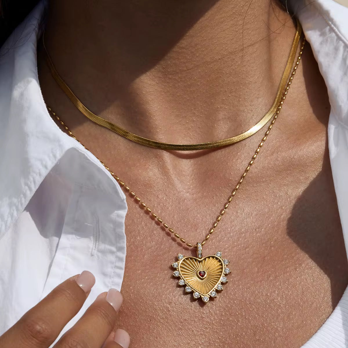 Waterproof gold flat chain necklace for swimming and active daily lifestyles.