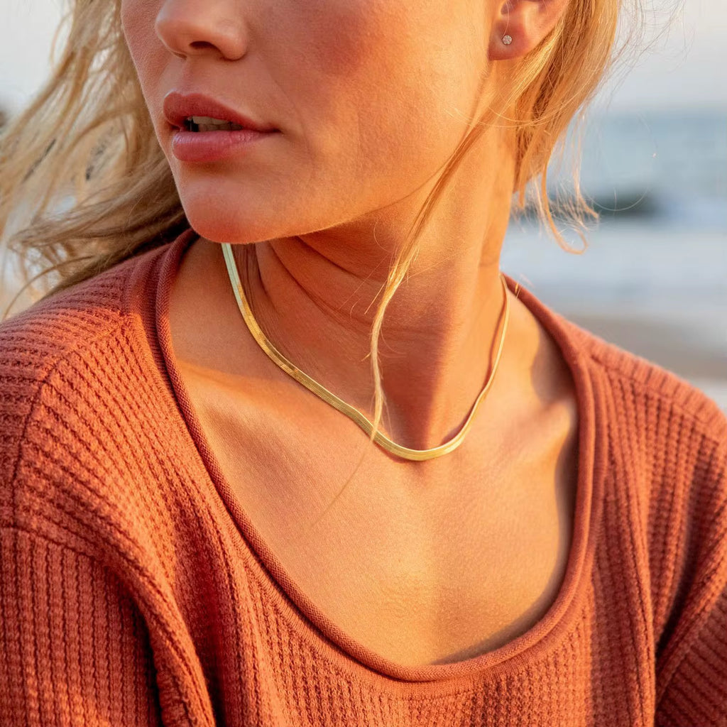 Liquid Metal Herringbone necklace featuring a 0.31cm wide flat-link design in 18k gold.