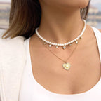 Waterproof gold pearl necklace with teardrop crystal charms for swimming and daily wear.