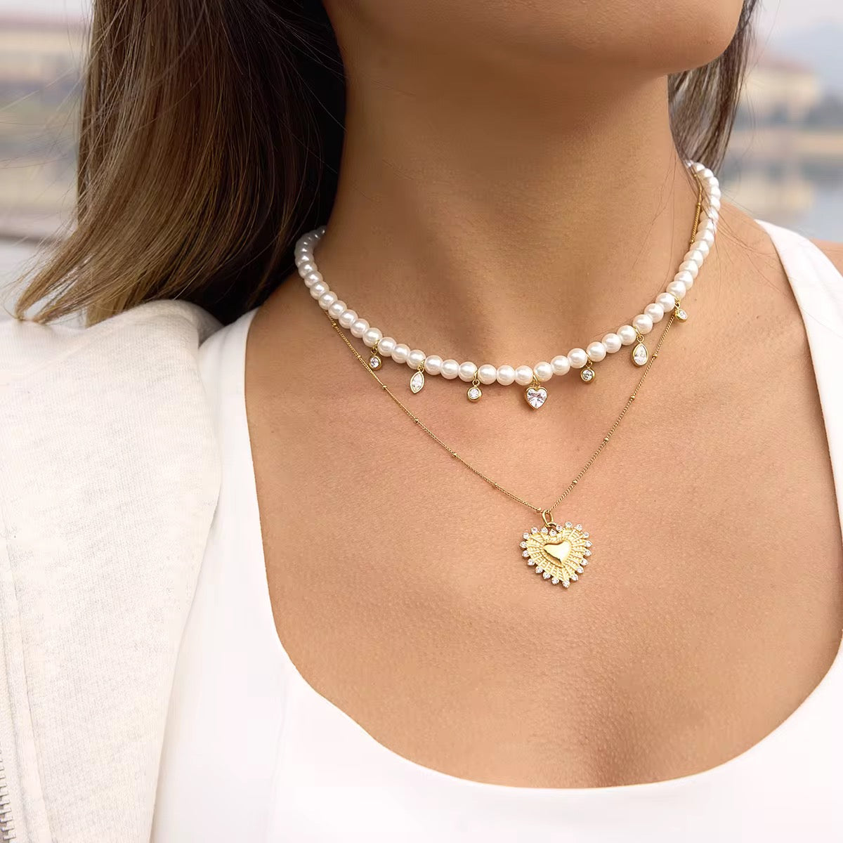 Waterproof gold pearl necklace with teardrop crystal charms for swimming and daily wear.