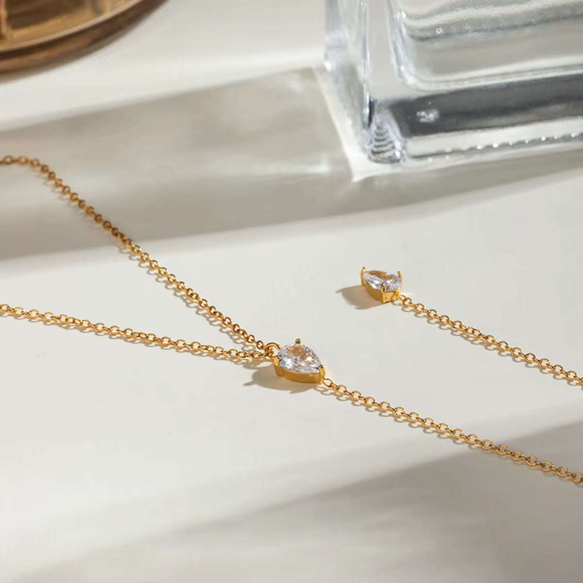 Hypoallergenic 18k gold plated stainless steel lariat necklace for sensitive skin.