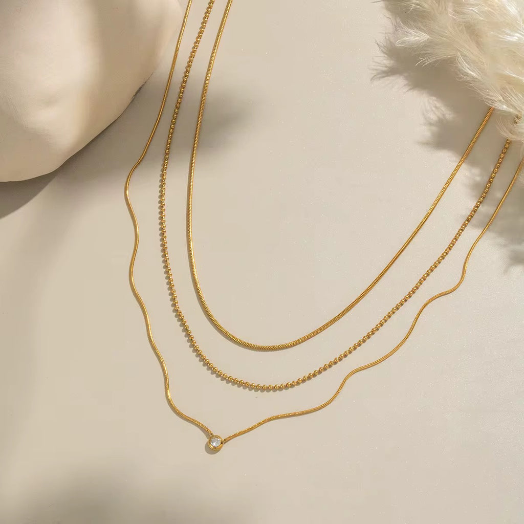 Hypoallergenic 18k gold plated stainless steel layered necklace for sensitive skin.