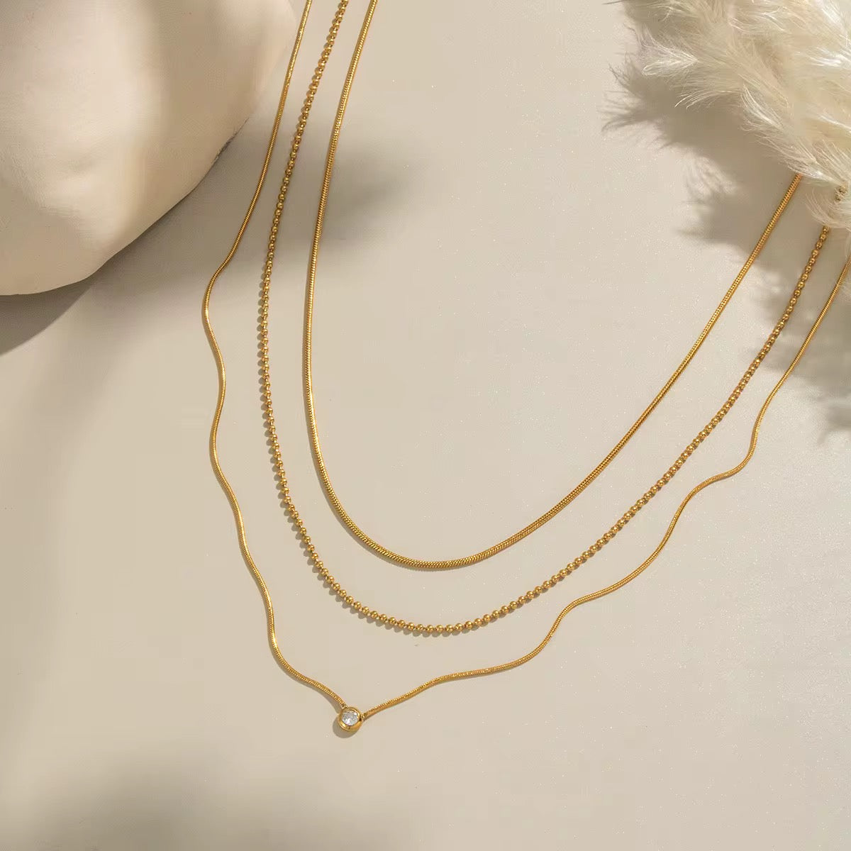 Hypoallergenic 18k gold plated stainless steel layered necklace for sensitive skin.