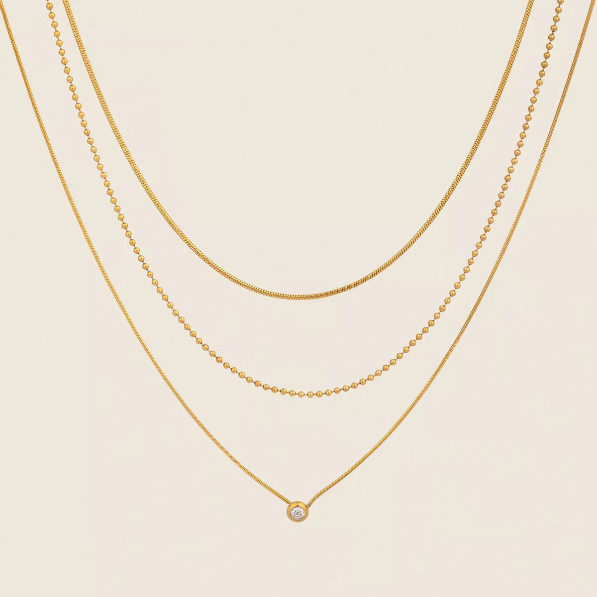 Tarnish-free ocean-proof Gilded Trio necklace safe for salt water and beach wear.
