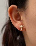 Pearl Cross Studs featuring 18k gold PVD plated stainless steel and pearls.