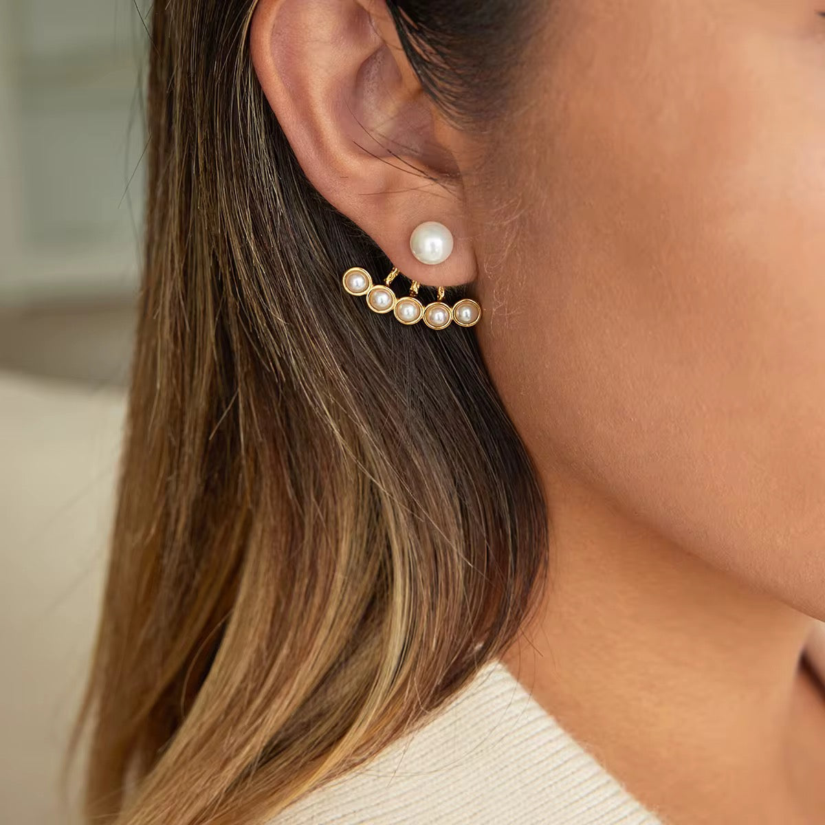 Pearl Fan ear jackets featuring 18k gold PVD plated stainless steel and bezel-set pearls.