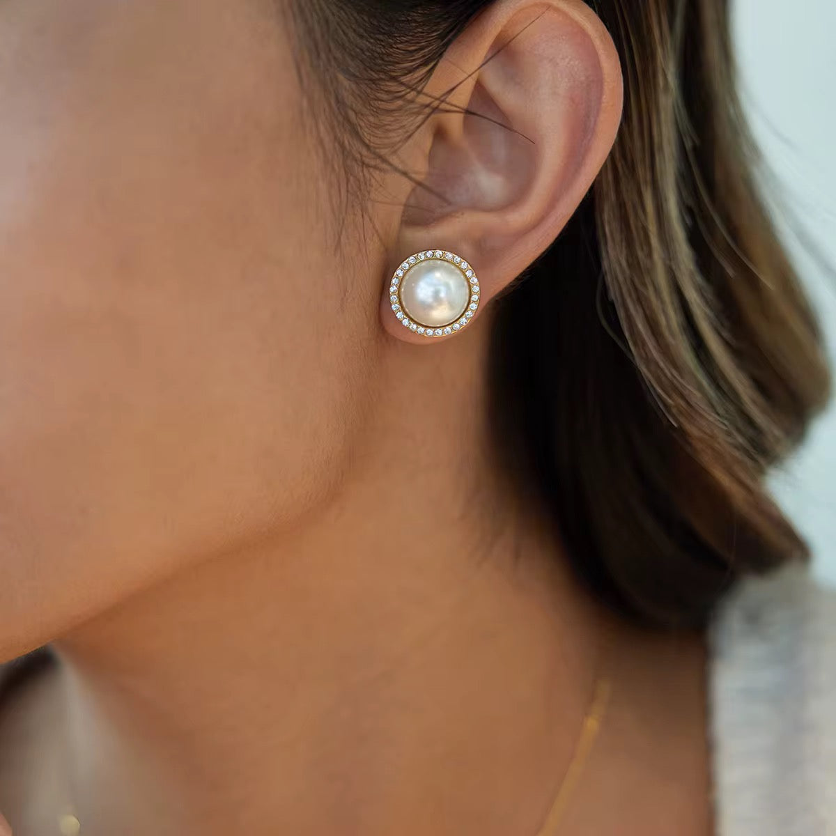 Waterproof gold pearl statement earrings for swimming and active lifestyles.