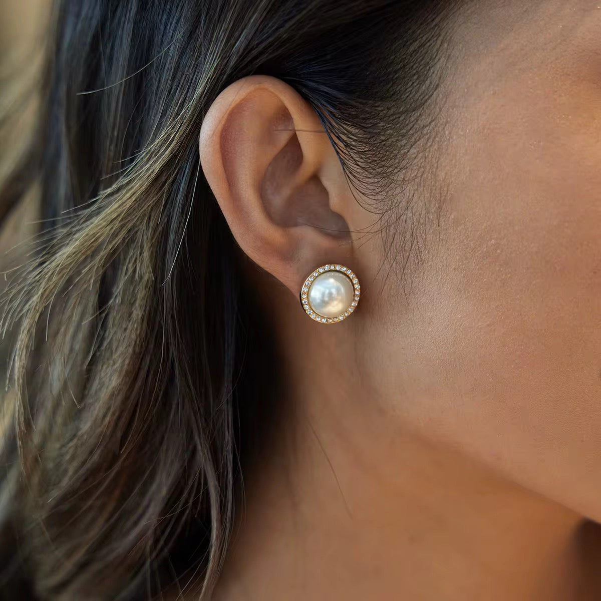 Hypoallergenic 18k gold plated stainless steel pearl studs for sensitive ears.