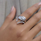 Waterproof silver asymmetrical statement ring with two nested brilliant teardrop stones.