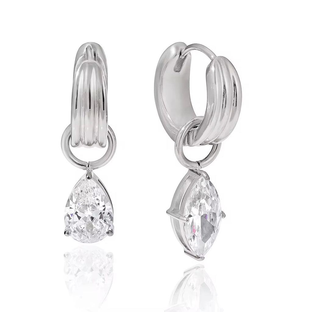 Waterproof gold huggie earrings with large brilliant-cut teardrop stones for swimming.
